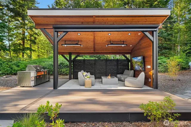 The cabana offers year-round outdoor entertaining and versatile flex space, complete with integrated heaters and a wind-sensor privacy screen