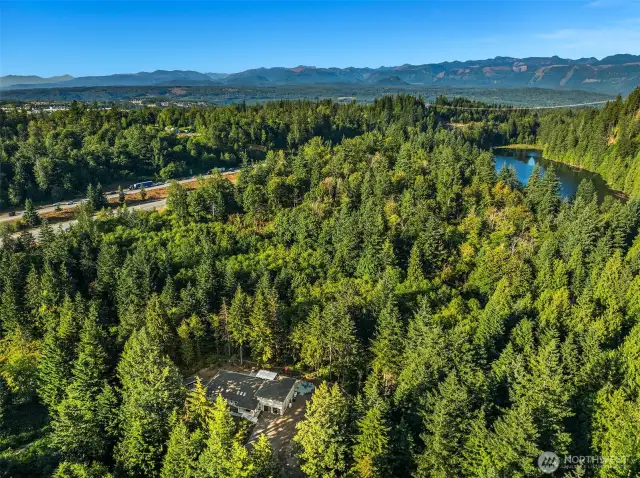 Set on 1.6 acres with rare access to serene Echo Lake, shared by only a privileged few, and private walking trails