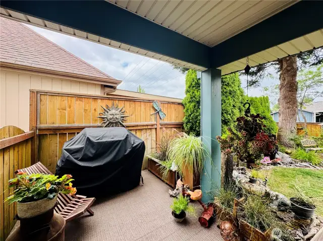 Gorgeous covered back patio with space for grilling