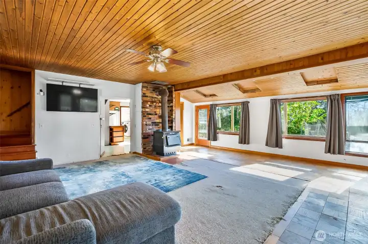 Large windows with natural light and gorgeous cedar plank ceilings