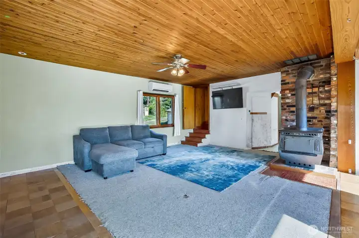 Large windows with natural light and gorgeous cedar plank ceilings
