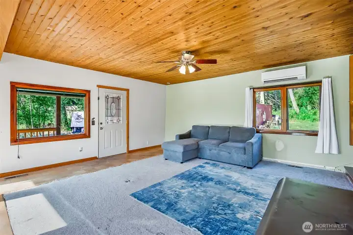 Large windows with natural light and gorgeous cedar plank ceilings