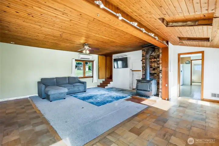 Large windows with natural light and gorgeous cedar plank ceilings