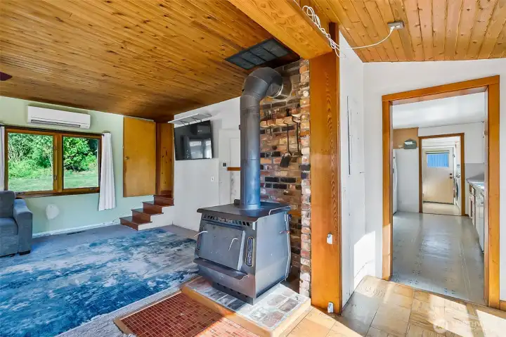 Large windows with natural light and gorgeous cedar plank ceilings