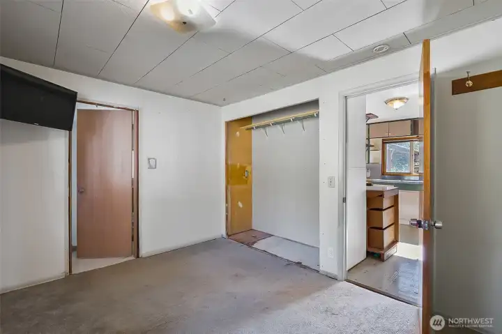 Primary bedroom with large window and en-suite
