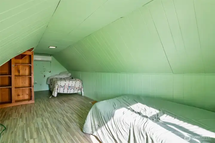 Whimsical upstairs bedroom with window and closet