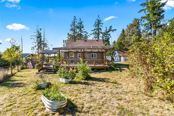 Huge yard with raised garden beds