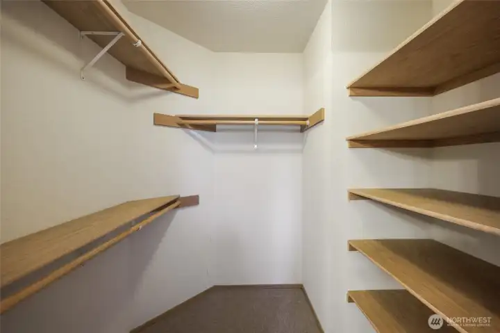 Primary closet with shelving ...