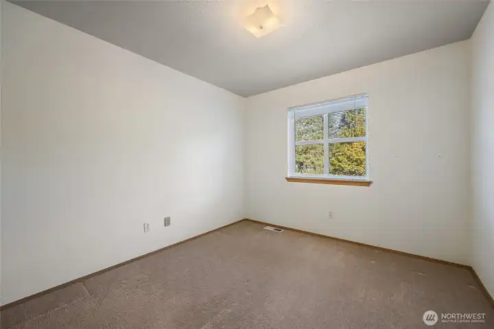 The third bedroom, overlooking the treed backyard!