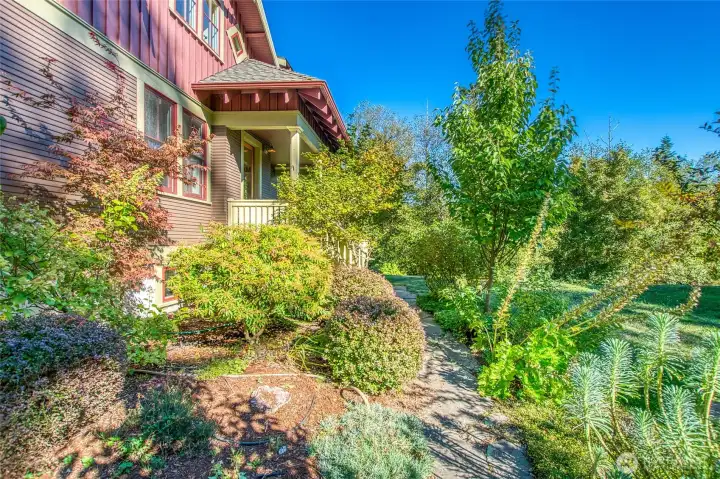 Mature landscaping surrounding the flagstone path, complete with drip irrigation, welcomes you home.
