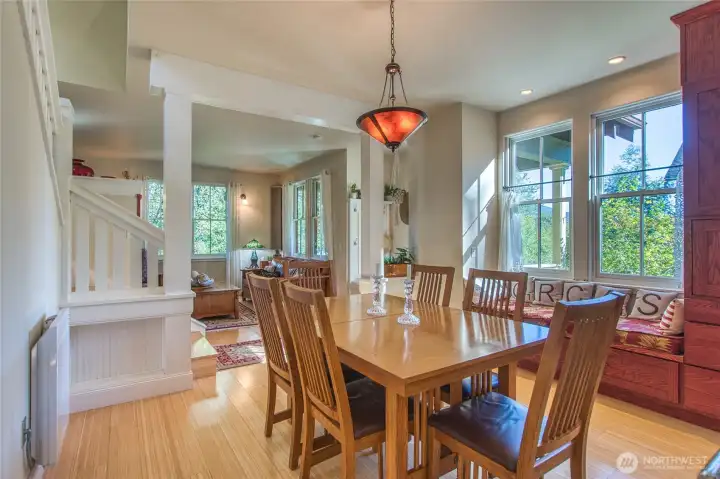 The open floorplan on the main level has spaces defined by custom millwork.