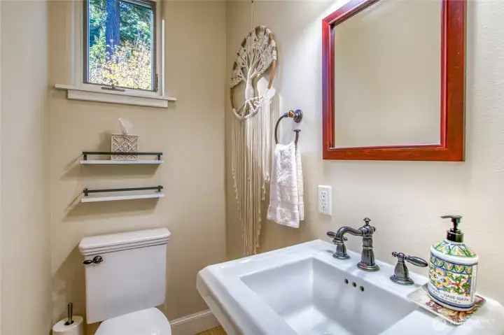 A powder room is conveniently located on the main level. Each level has a bathroom.