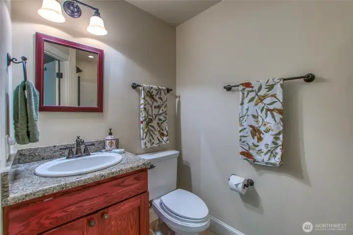 Granite countertops grace the vanity.