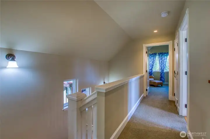 The open hallway leads to the bathroom and the largest bedroom. ther is a full sized washer and dryer conveniently located in the hallway behind a door.