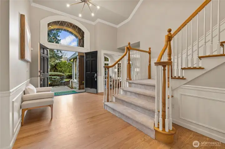 Grand entrance with soaring ceilings reveals a tastefully updated home