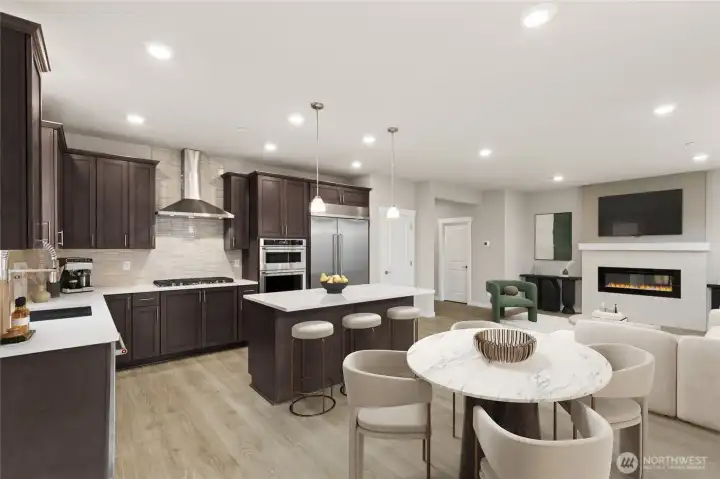 Gorgeous kitchen with plenty of storage and counter space to prep your meals or host a dinner party!  48" counter depth side by side built in refrigerator, gas cooktop and built in micro/oven - home for sale will include white cabinetry. Virtually staged