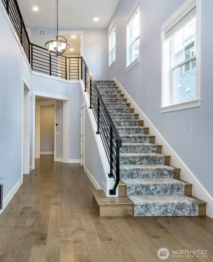 Light filled entry. There is also a custom entry rug (not pictured) that will stay.