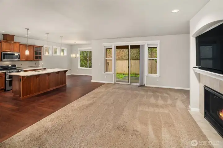 Open layout living room to kitchen to back patio.