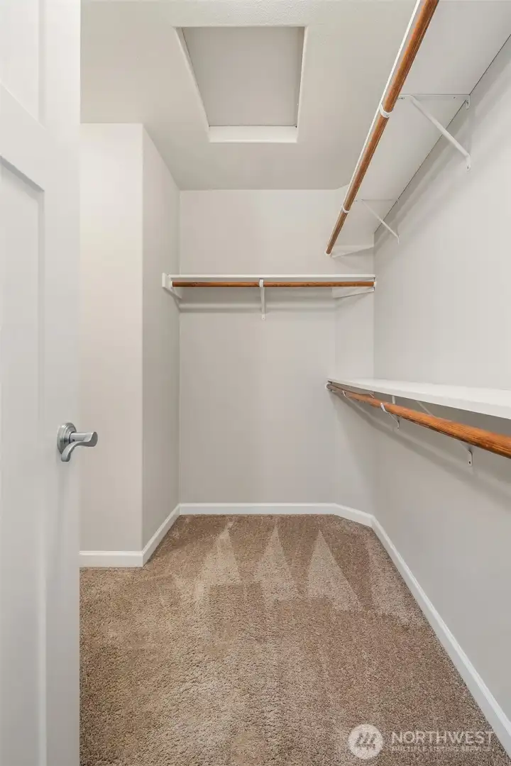 Walk in closet for primary bedroom.