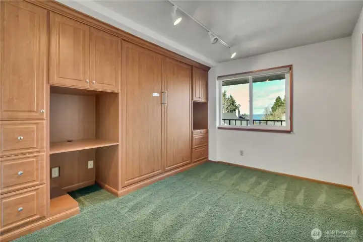The second bedroom/office features a custom Murphy bed, ample storage, and pullouts, so it can double as an office. There is another closet just on the right side of the room--not in the picture.