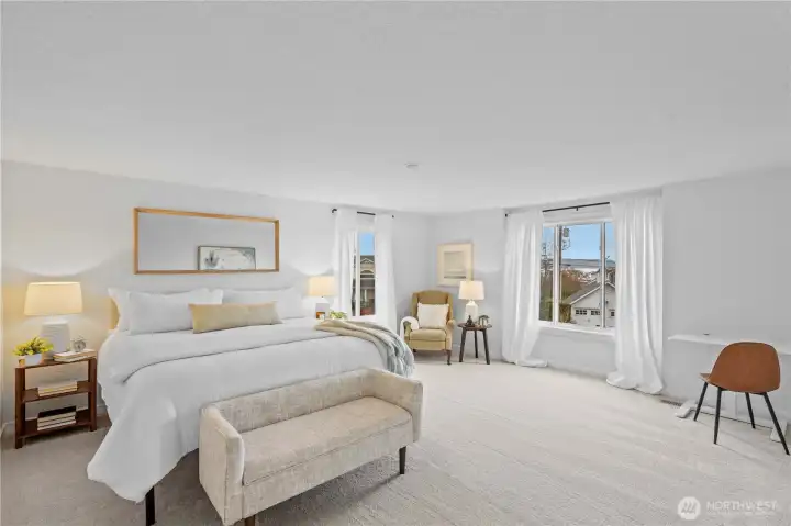 Primary suite is oversized with views to the water and the amazing cherry tree outside your window.  With a huge walk in closet and private bath, this is your escape!
