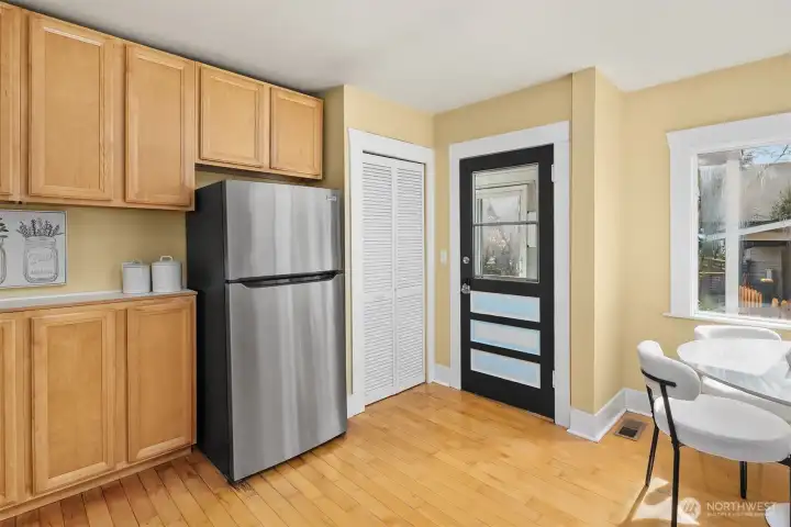 Large kitchen with eating area and direct access to the large back deck and peaceful backyard