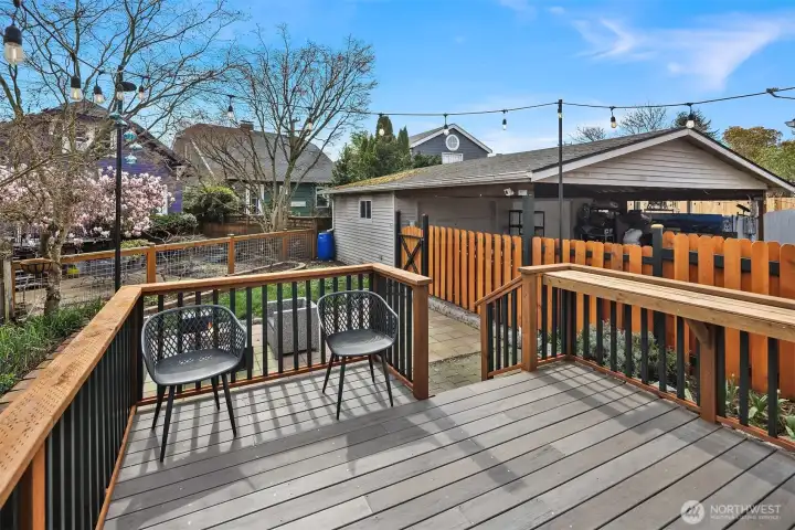 Large deck right off the kitchen, overlooking the fully fenced, peaceful backyard