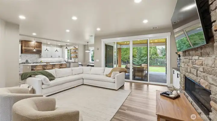 Open concept design with easy flow into the kitchen, dining area, and outdoor living space.