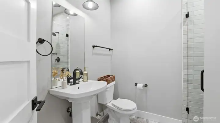 Main floor bathroom that includes a shower. Perfect for main level living and multi-generational living!