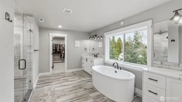LPV flooring and double sinks with quartz countertops.