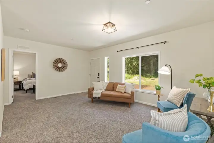 Living room off entry looking into the primary suite.
