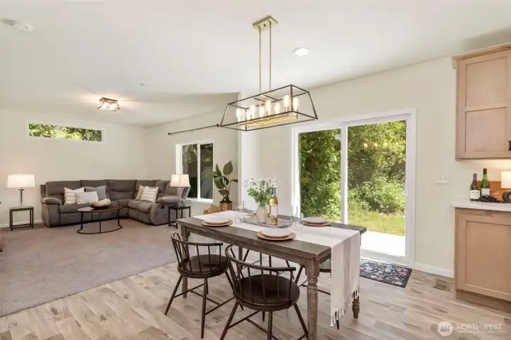 Dining room with slider to back patio and private backyard!
