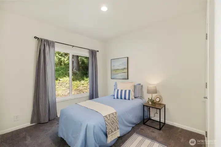 Guest bedroom #1 on opposite side of home from primary suite.
