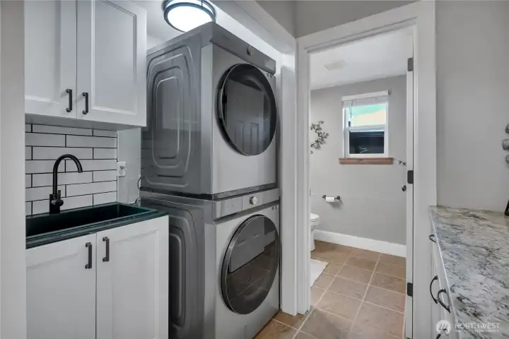 Laundry space with sink and storage