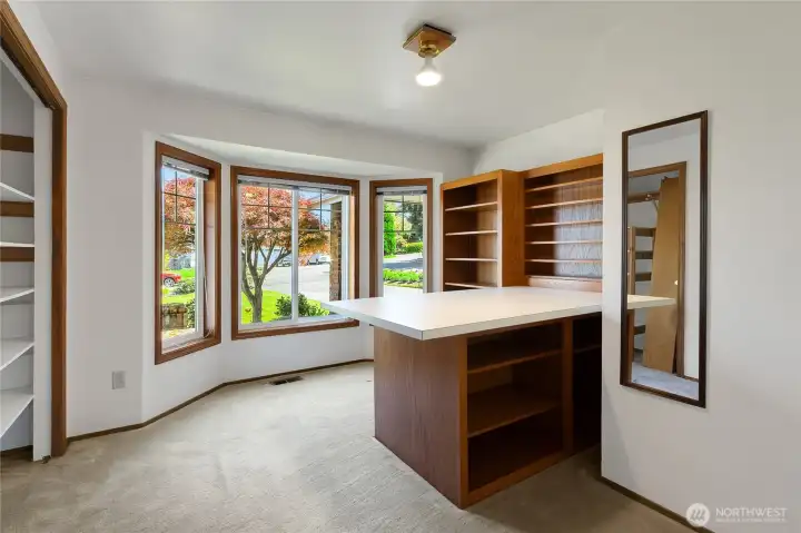 2nd bedroom on main level currently has built ins used for a sewing studio