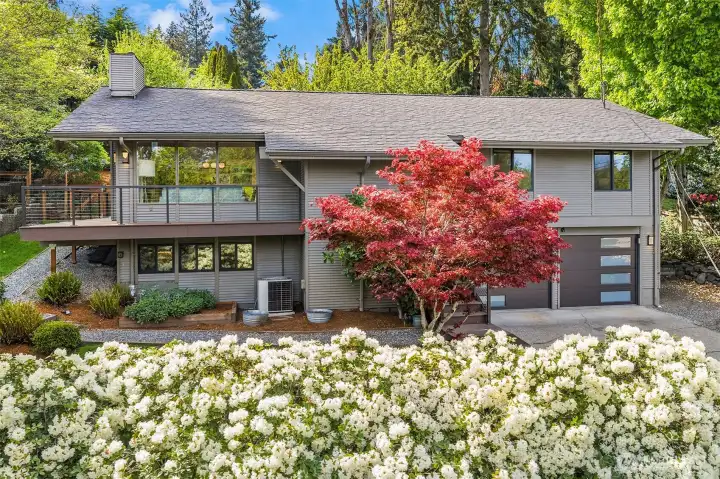 Welcome to this stunning Northwest Contemporary home, nestled in the serene Tarywood neighborhood on the south end of Mercer Island.
