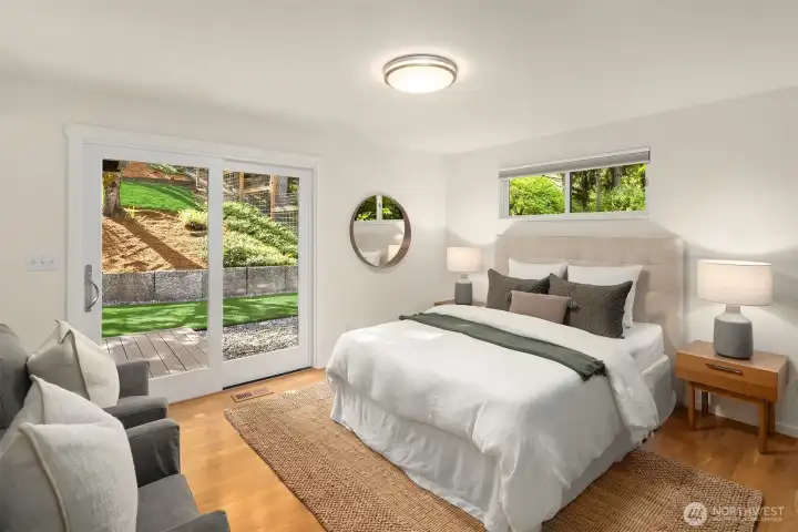 Luxurious primary suite with en-suite 3/4 bathroom and French slider to the back deck.