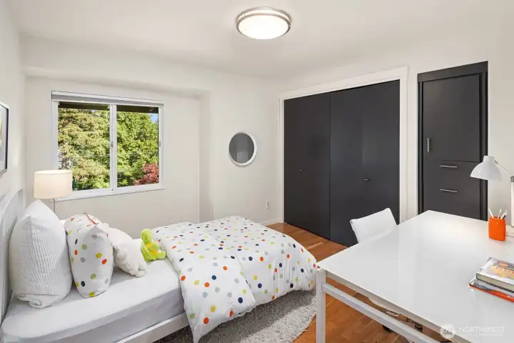Third bedroom on the main floor featuring wonderful built-in storage and closet space.