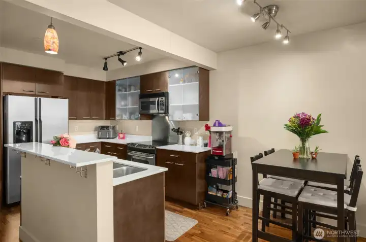 Kitchen with island and breakfast bar + separate dining area Kitchen with island and breakfast bar + separate dining area