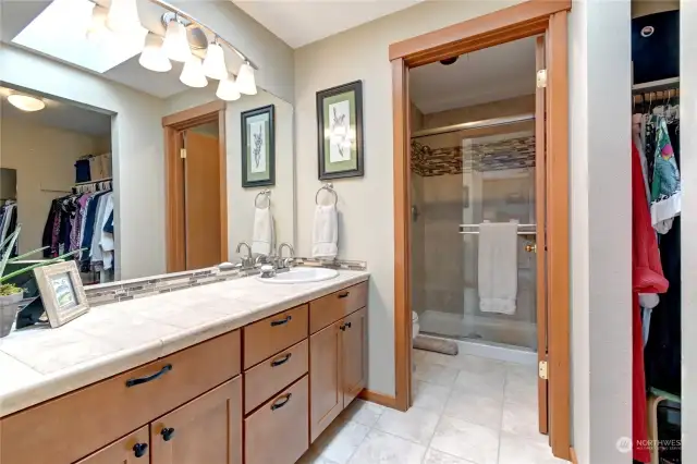Natural light fills the primary bathroom with walk-in closet.