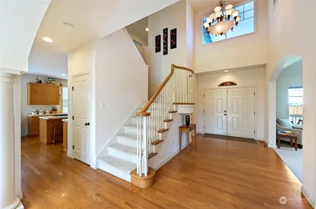 The vaulted entry and grand sweeping staircase will greet your guests as they enter this light filled home.