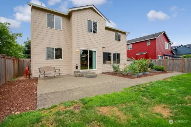 Extended patio plus garden area & sidewalk around to the side