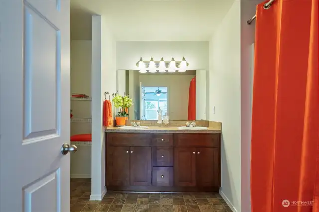 Double sinks and a built in linen closet space - room for all of your things!