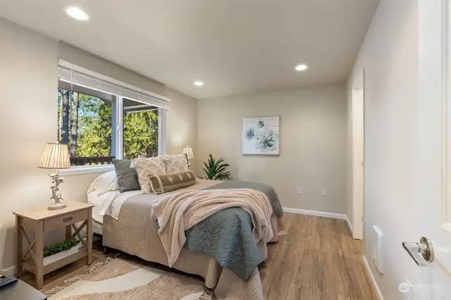 Primary bedroom with ensuite and lake view