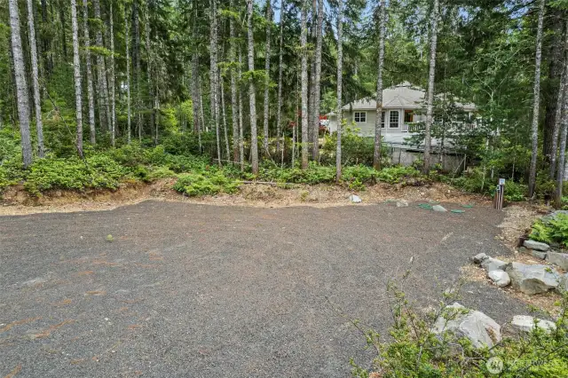 The future home site is perfect for your travel trailer also.  There is  RV hookup for sewer drainage right there!!  This owner thought of everything, you will see that once you tour this property.