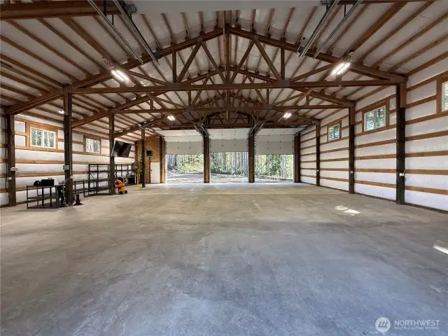 This building has the convenience of drive through 15' doors.  The interior is fully insulated.  The concrete floor was poured with the utmost of care. Not one crack.  Also included,  fiber optics, heaters, security cameras, & engineered structural plans for a loft to maximize storage or potential living quarters.
