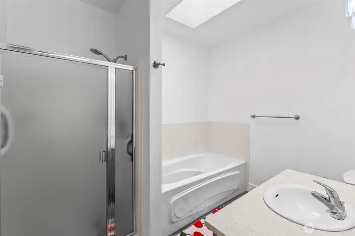 Primary Bathroom with stand alone shower and soaking tub