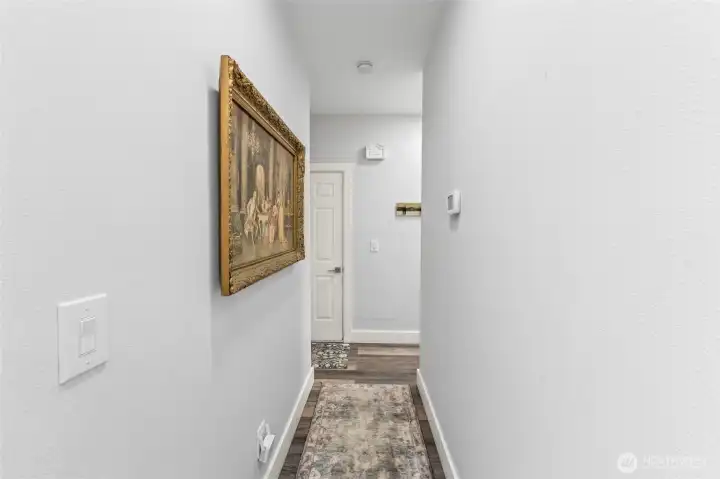Hallway to 2nd bedroom and garage