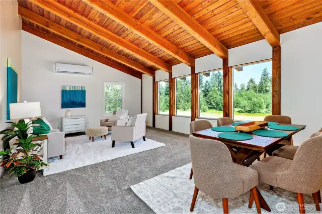 wood-framed vaulted ceilings in spacious living room