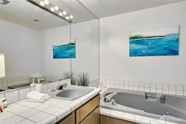 Jetted soaking tub in bathroom upstairs (but not in the primary ensuite